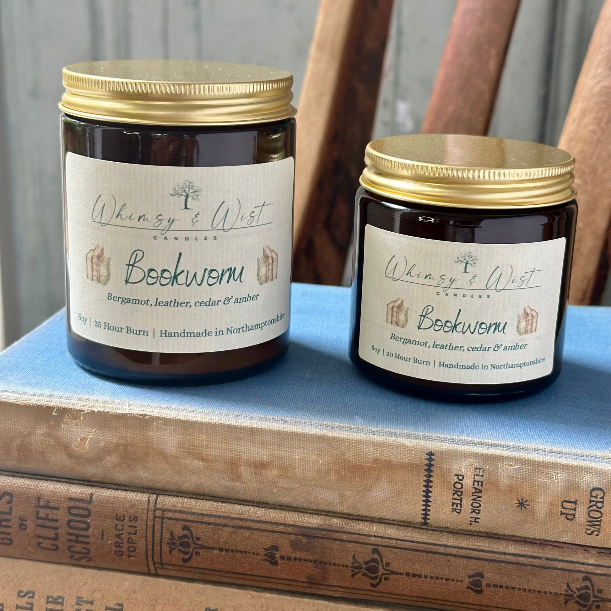 Bookworm soy candle in amber apothecary jar with gold lid, handmade in the UK.
