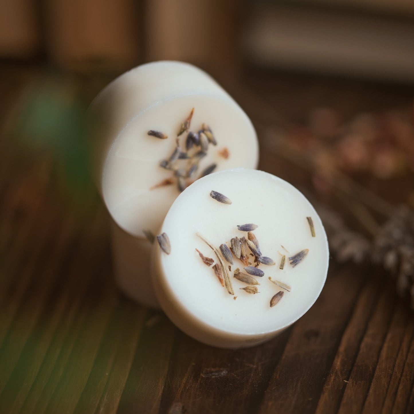 Wax melts, decorated with lavender on a wooden surface