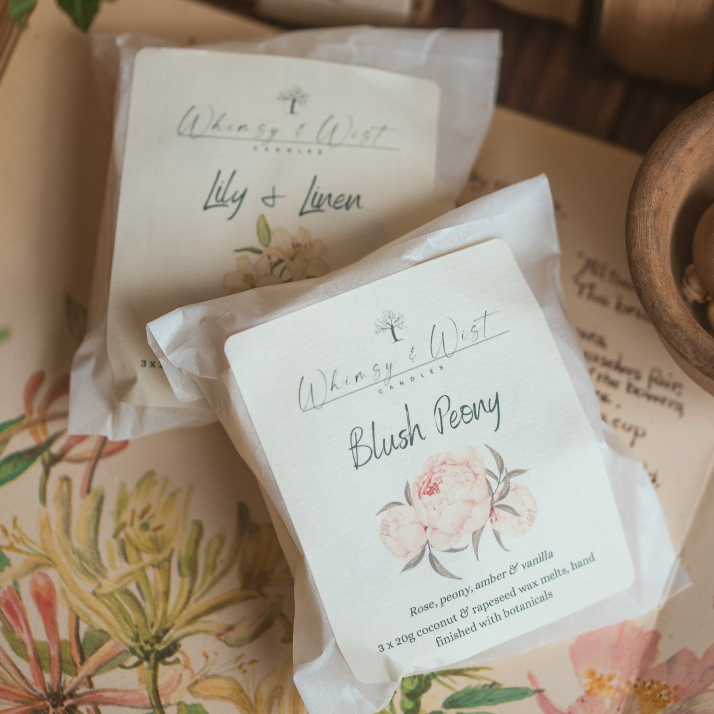 Wax melt packs against a floral background