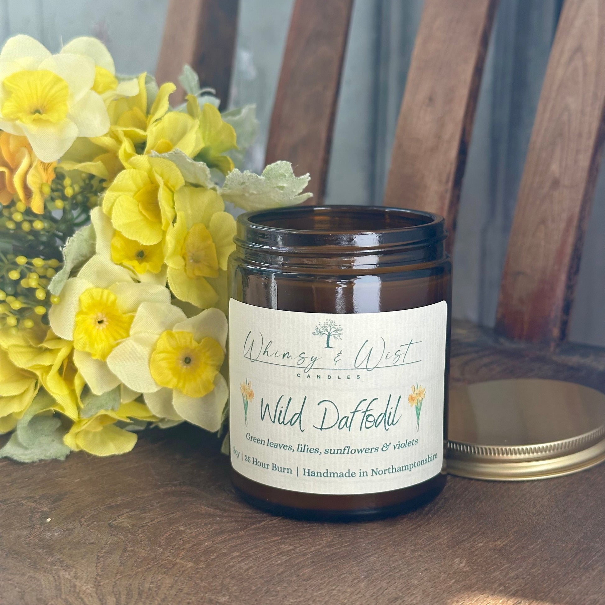 Wild Daffodil soy candle in amber apothecary jar with gold lid, handmade in the UK.
