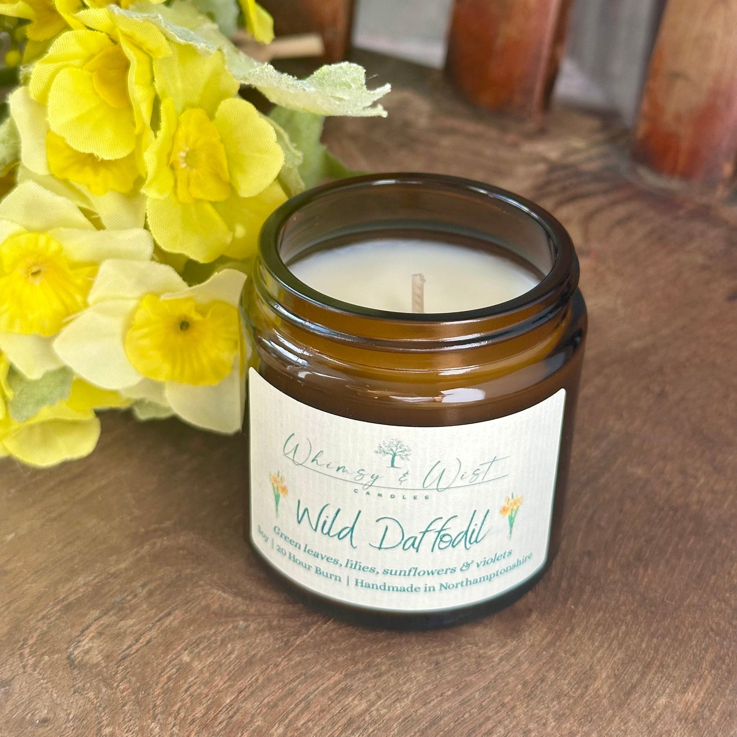 Wild Daffodil soy candle in amber apothecary jar with gold lid, handmade in the UK.