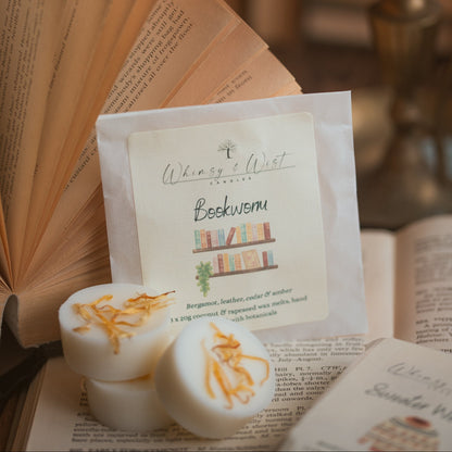 Bookworm wax melts, lying on some books