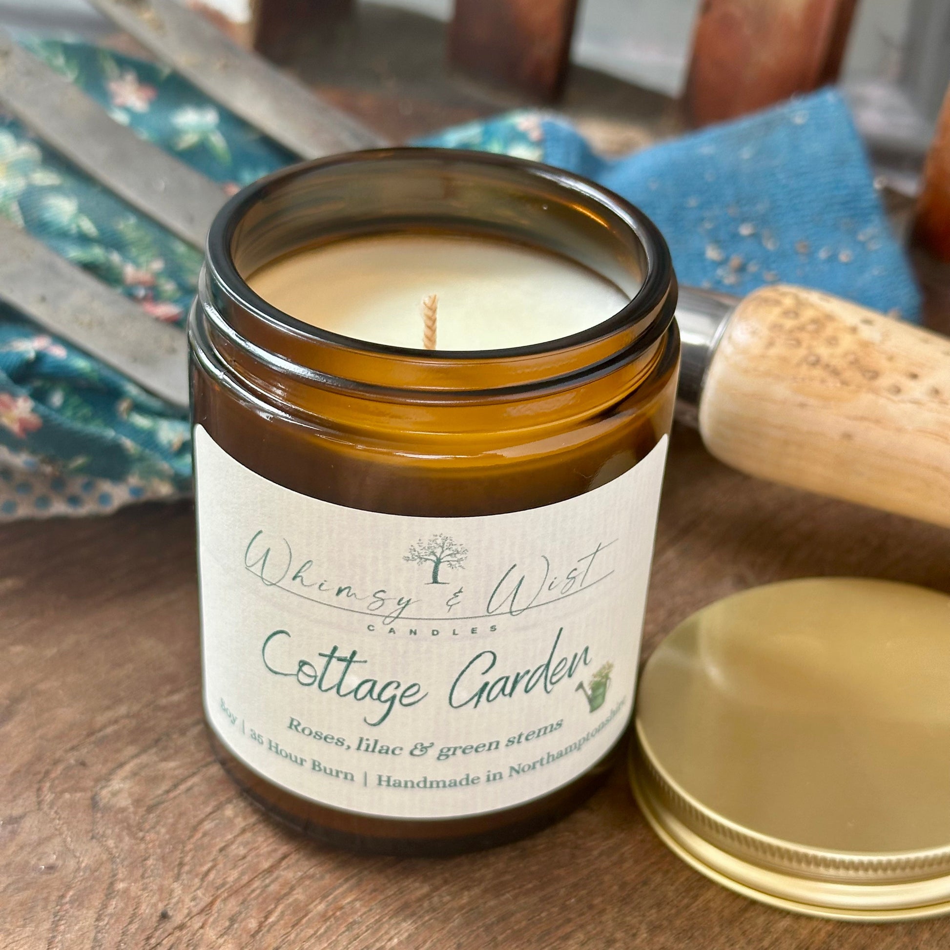Cottage Garden soy candle in amber apothecary jar with gold lid, handmade in the UK.