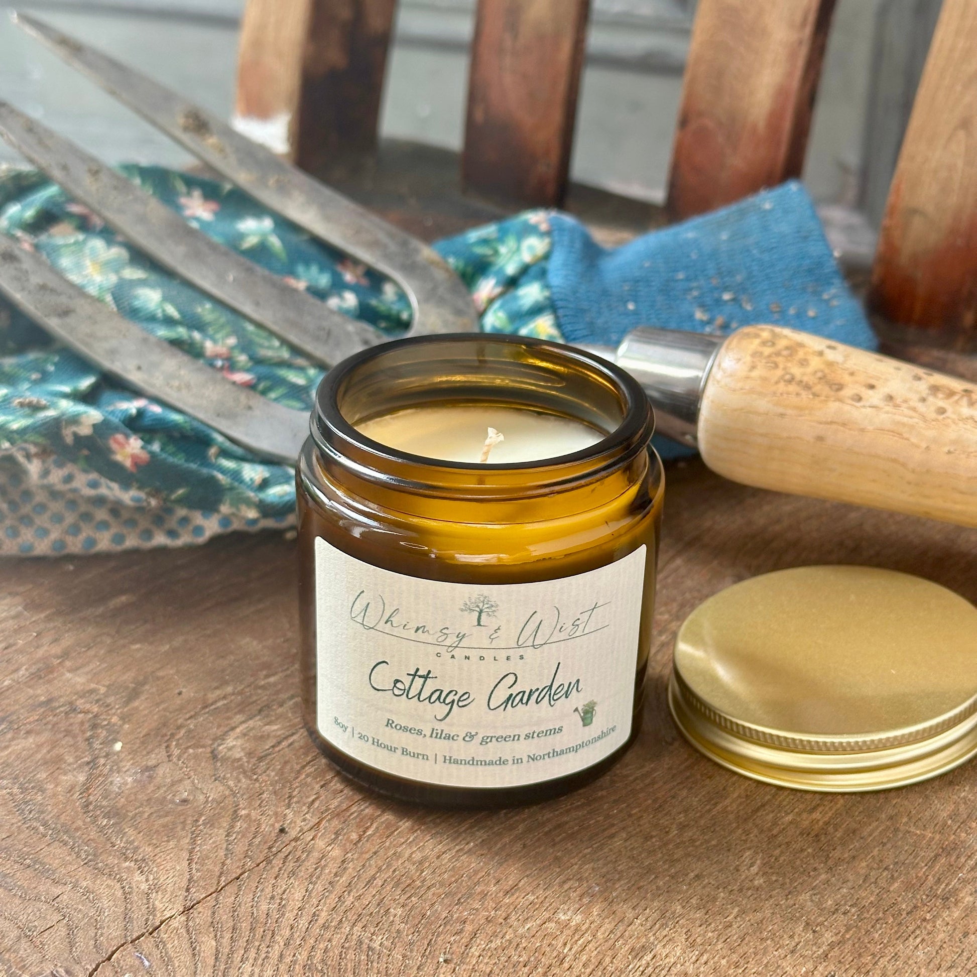 Cottage Garden soy candle in amber apothecary jar with gold lid, handmade in the UK.