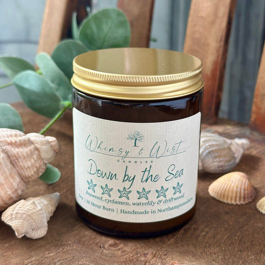 Down by the Sea soy candle in amber apothecary jar with gold lid, handmade in the UK.