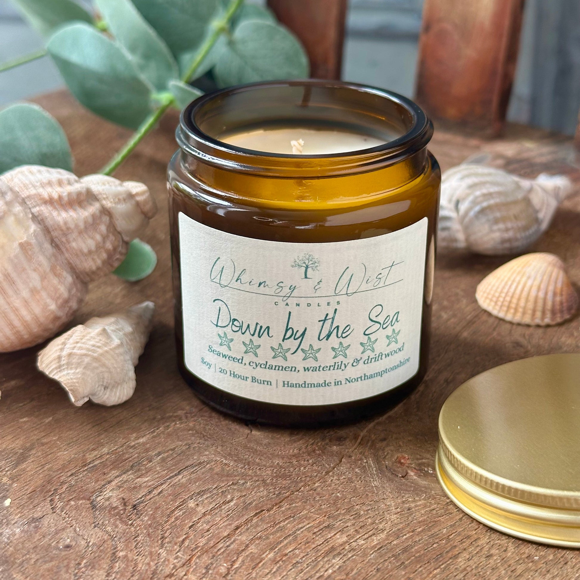Down by the Sea soy candle in amber apothecary jar with gold lid, handmade in the UK.