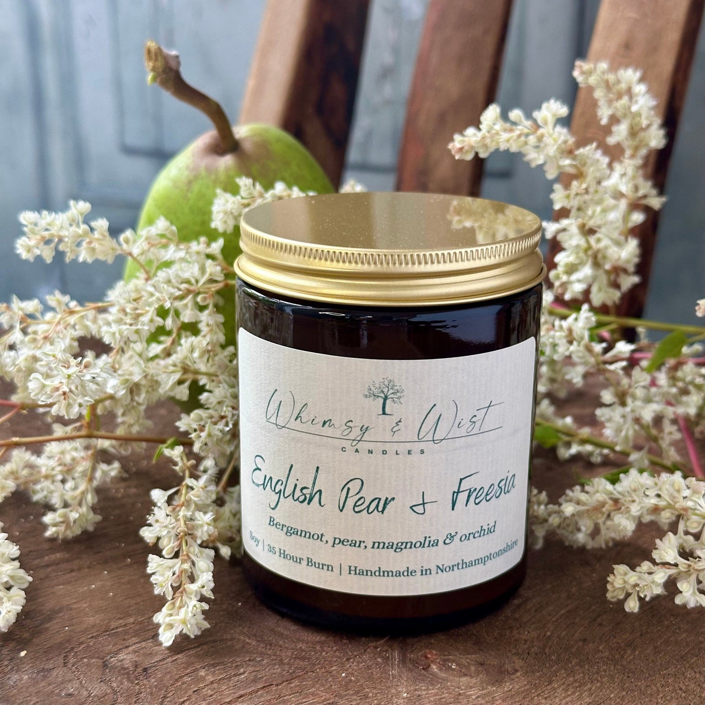 English Pear & Freesia soy candle in amber apothecary jar with gold lid, handmade in the UK.