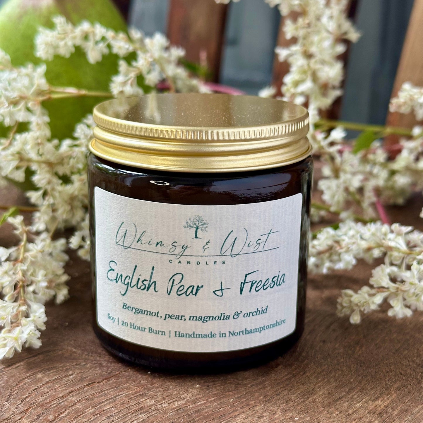 English Pear & Freesia soy candle in amber apothecary jar with gold lid, handmade in the UK.