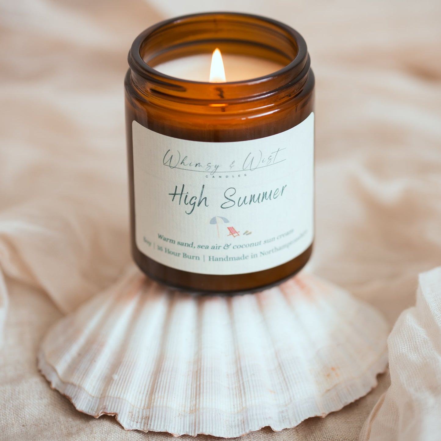 High summer candle with sea shell