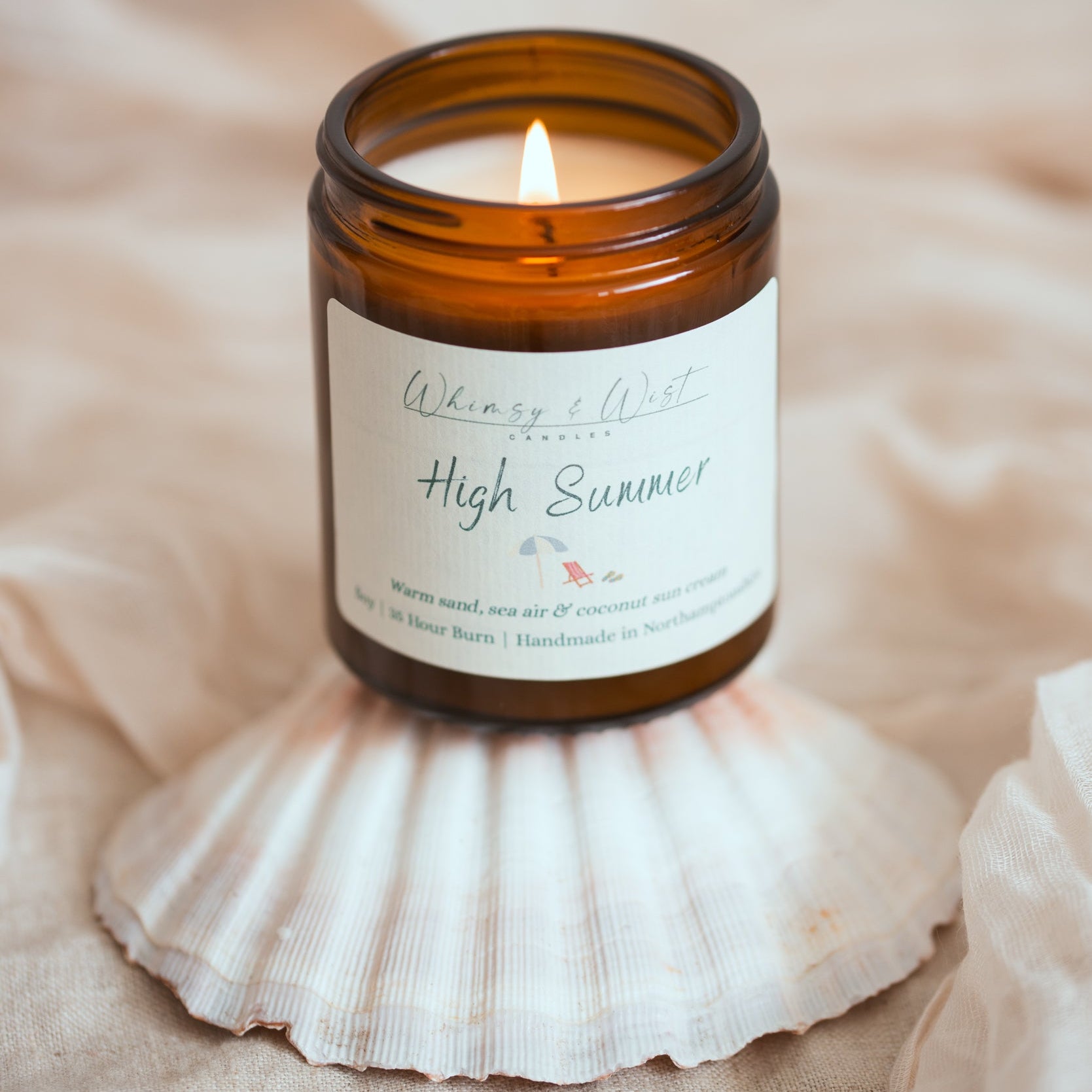 High summer candle with sea shell