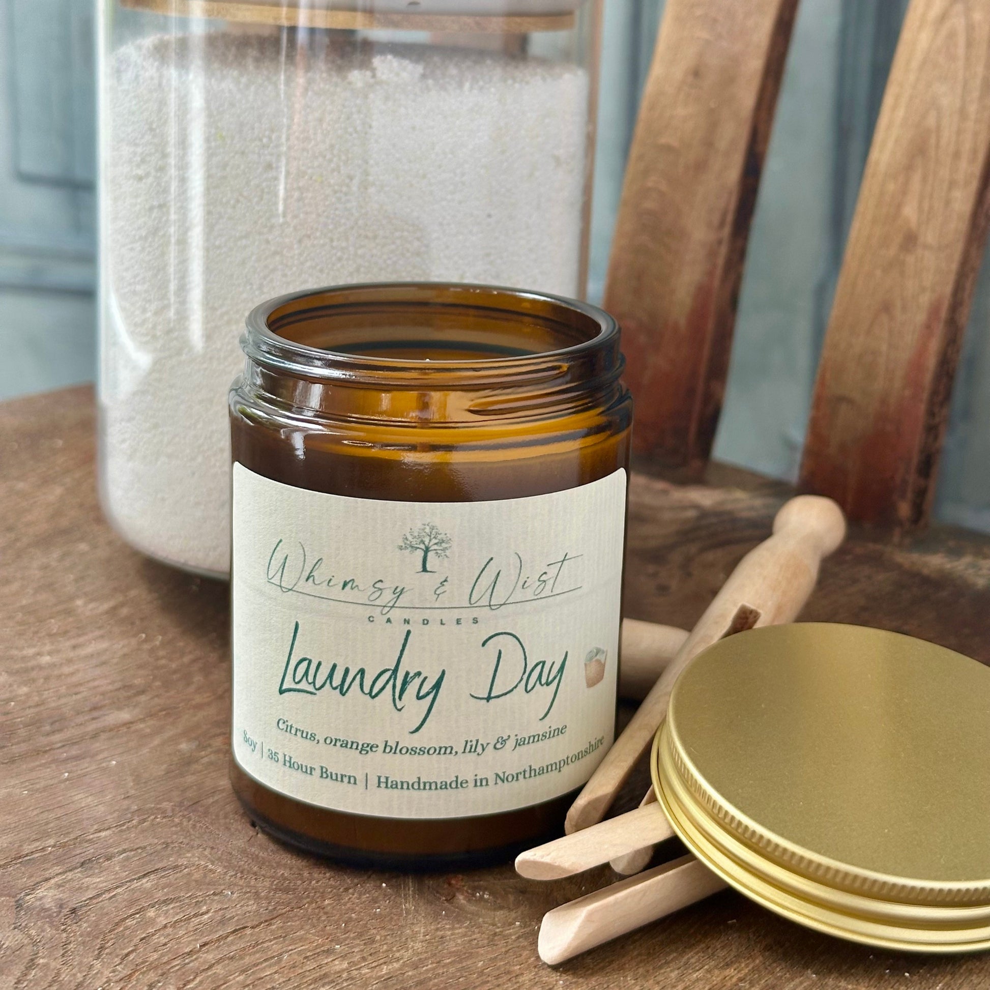 Laundry Day soy candle in amber apothecary jar with gold lid, handmade in the UK.