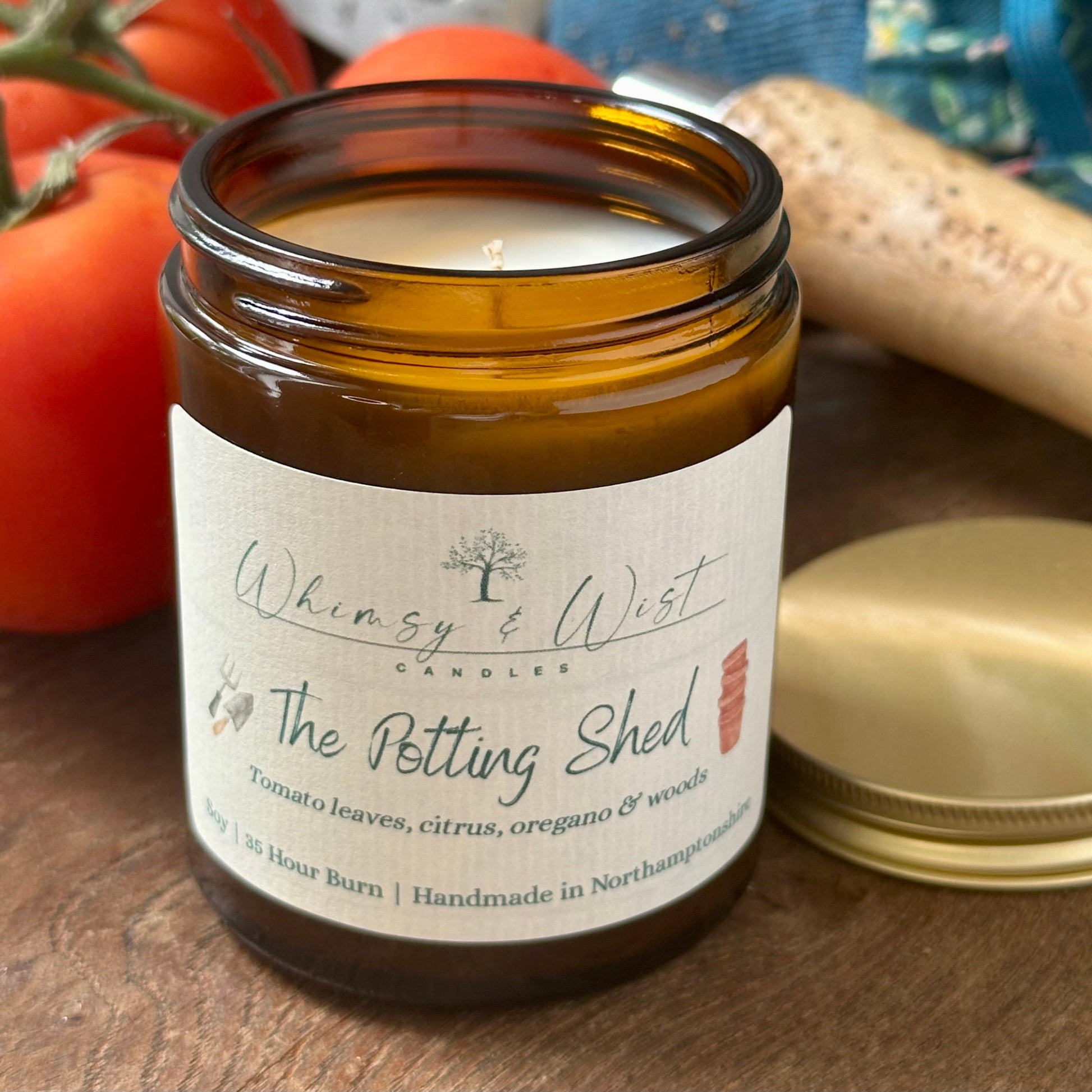 The Potting Shed soy candle in amber apothecary jar with gold lid, handmade in the UK.