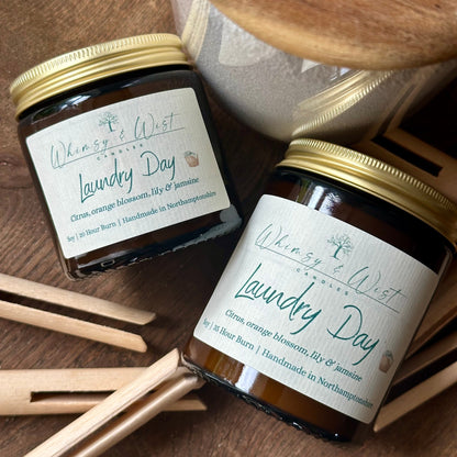 Laundry Day soy candle in amber apothecary jar with gold lid, handmade in the UK.