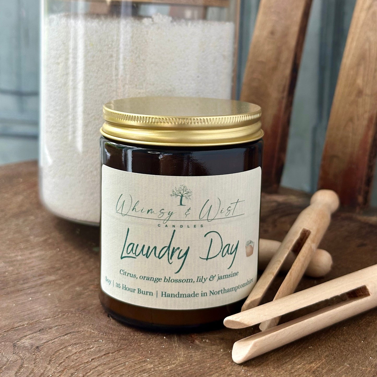 Laundry Day soy candle in amber apothecary jar with gold lid, handmade in the UK.