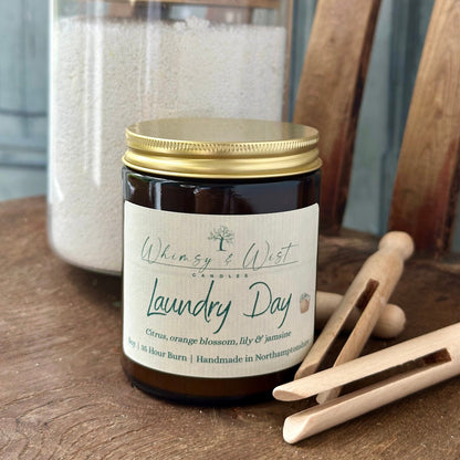 Laundry Day soy candle in amber apothecary jar with gold lid, handmade in the UK.