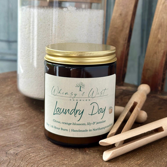 Laundry Day soy candle in amber apothecary jar with gold lid, handmade in the UK.