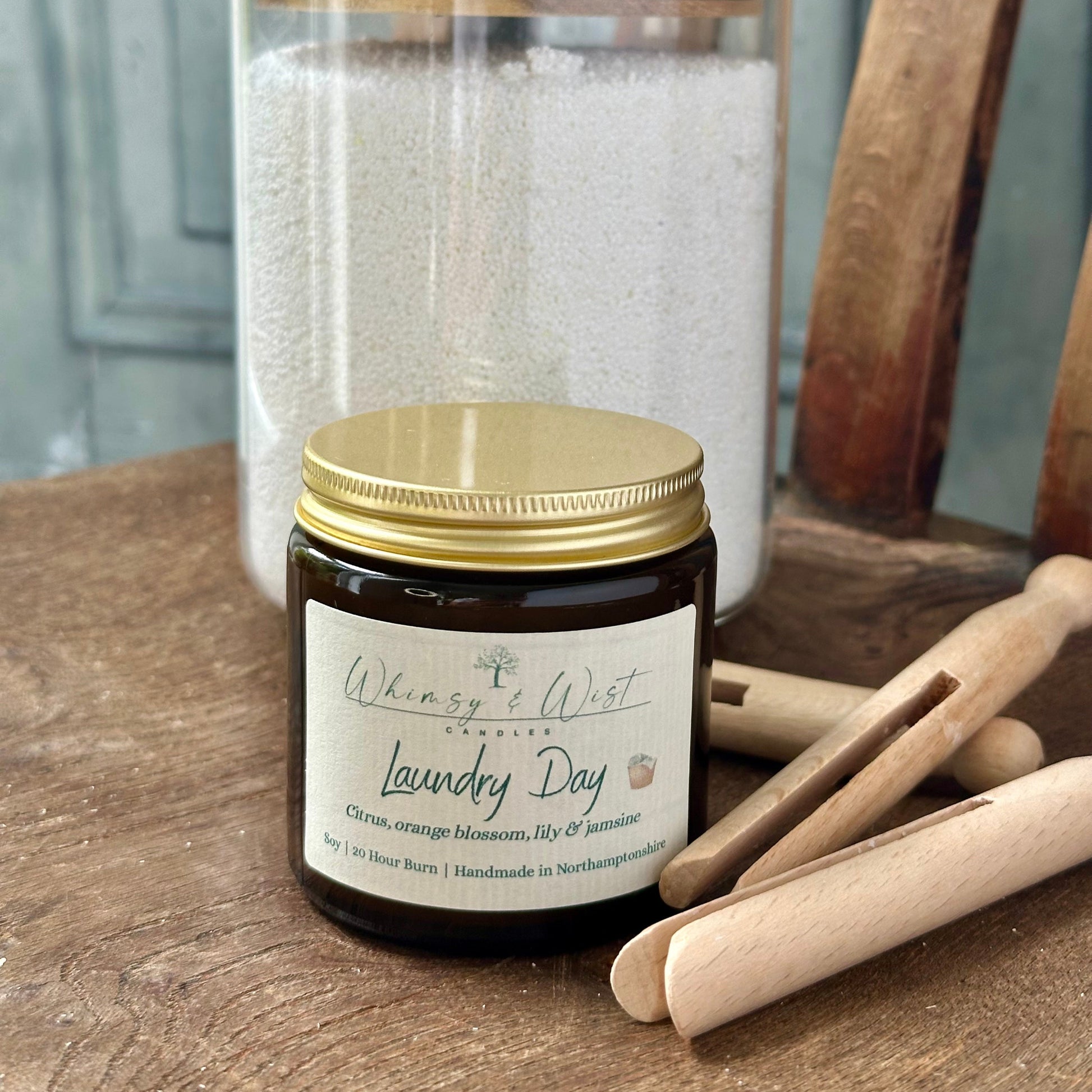 Laundry Day soy candle in amber apothecary jar with gold lid, handmade in the UK.