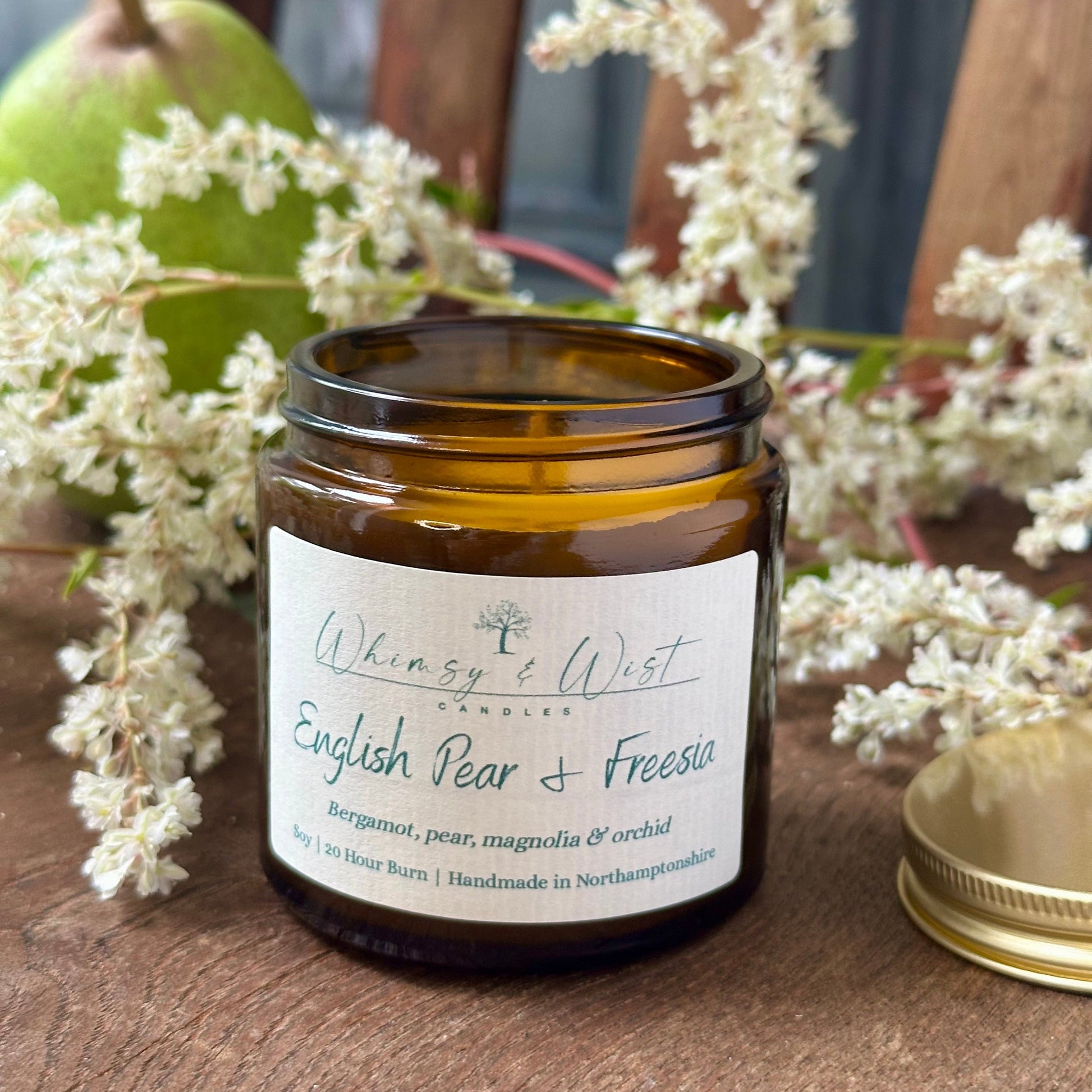 English Pear & Freesia soy candle in amber apothecary jar with gold lid, handmade in the UK.