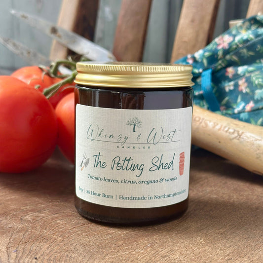 The Potting Shed soy candle in amber apothecary jar with gold lid, handmade in the UK.