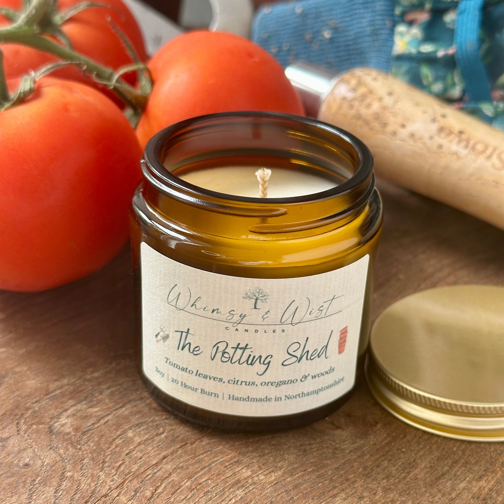 The Potting Shed soy candle in amber apothecary jar with gold lid, handmade in the UK.