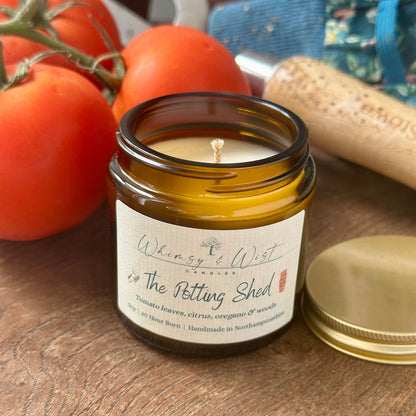 The Potting Shed soy candle in amber apothecary jar with gold lid, handmade in the UK.