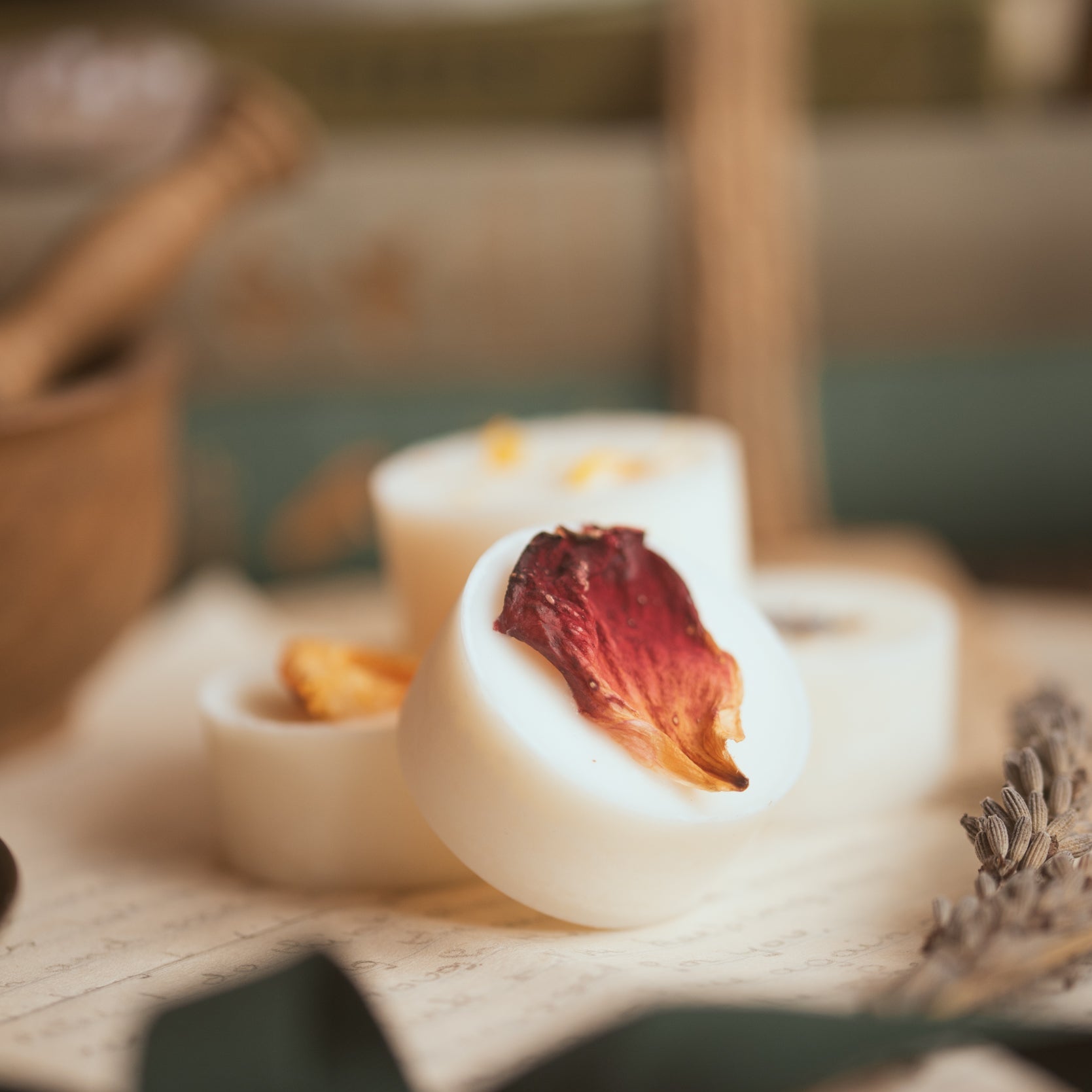 Rebalance wax melt, made with essential oils and decorated with a rose petal