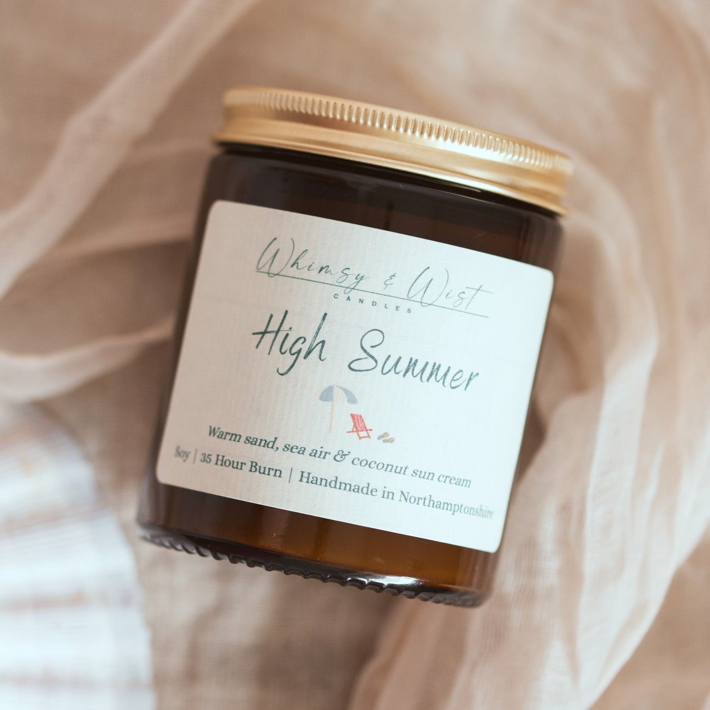 Summer scented candle in amber glass jar