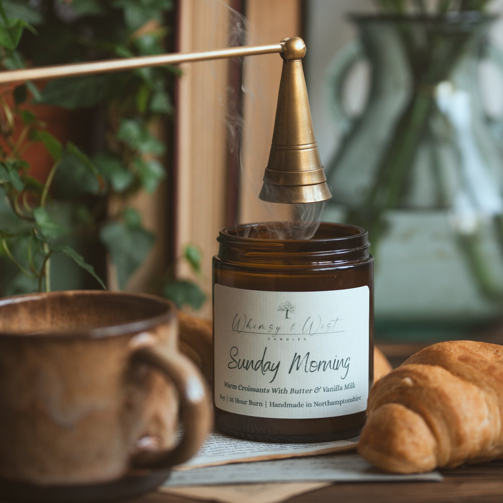Croissant scented candle being snuffed out