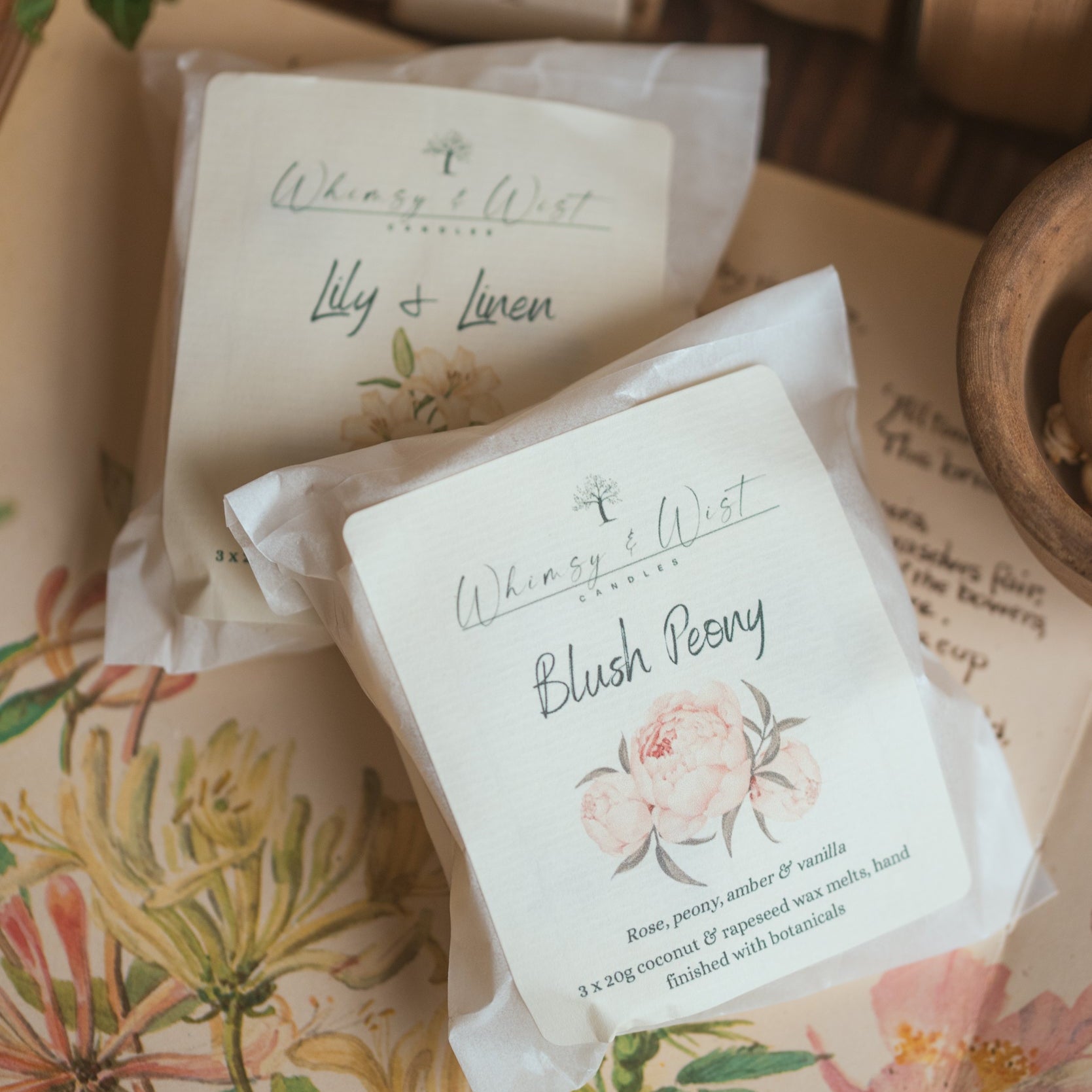 Wax melt packs against a floral background