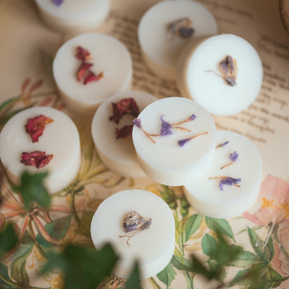 Wax melts with dried flowers on a vintage book