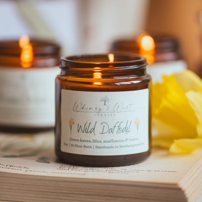 Wild Daffodil soy candle, styled with daffodils.
