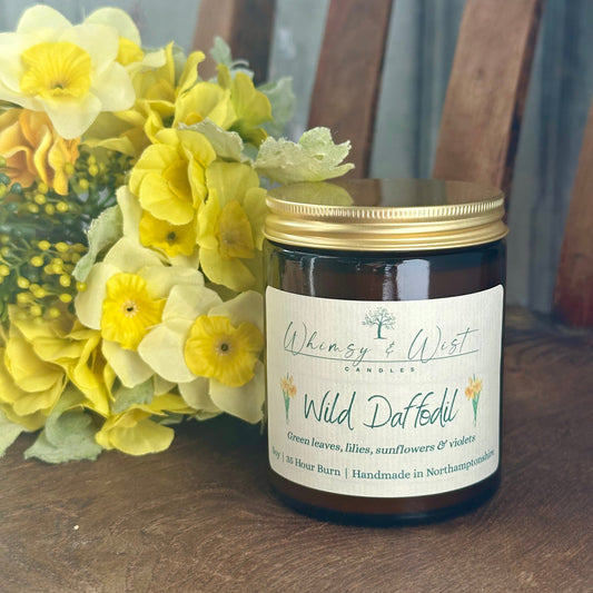 Wild Daffodil soy candle in amber apothecary jar with gold lid, handmade in the UK.
