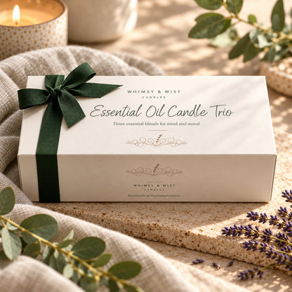 Whimsy & Wist Essential Oil Candle Trio gift box with a green ribbon, with eucalyptus and lavender