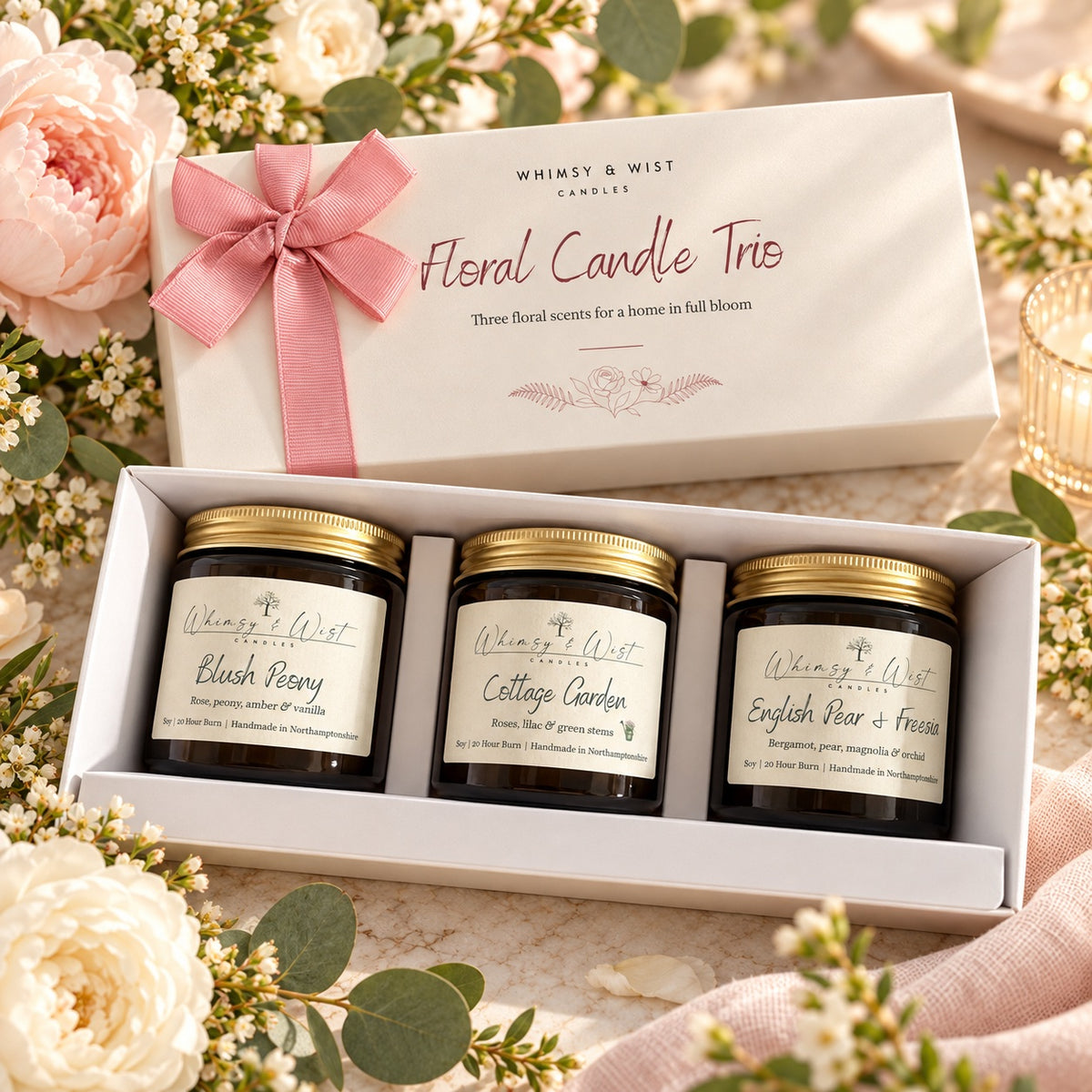 Open Floral Candle Trio gift box with Blush Peony, Cottage Garden and English Pear & Freesia 120ml amber jar candles among peonies